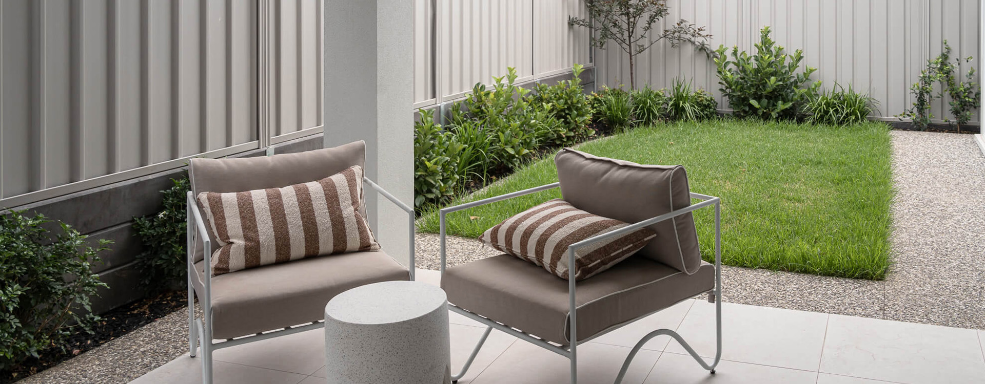Residential landscape garden design with modern seating area and lawn in Melbourne