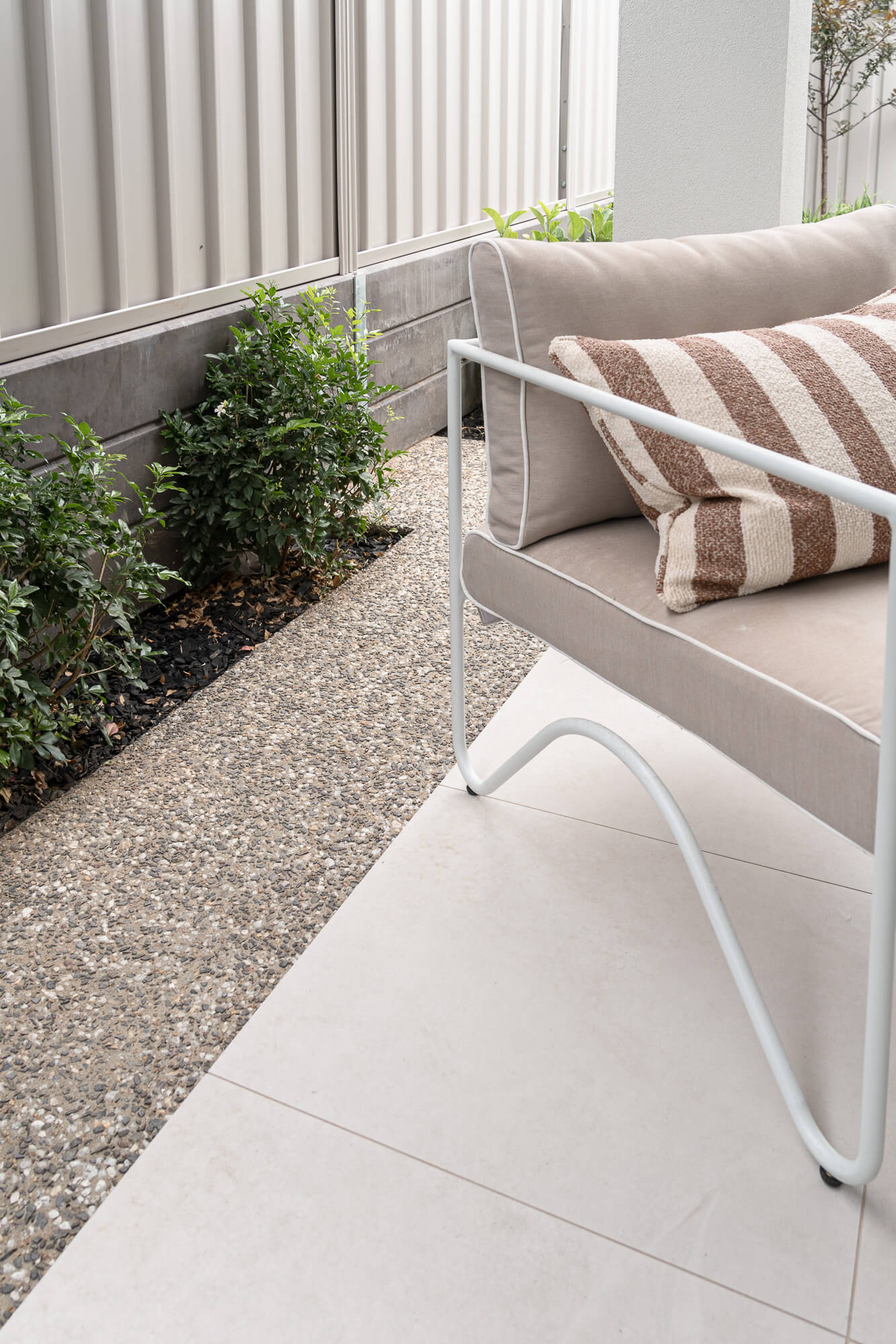 Outdoor seating area within a modern landscaped garden design in Melbourne